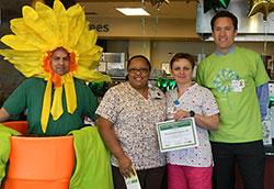 Elena Mattolin-Rakas, RN, and group with the DAISY mascot